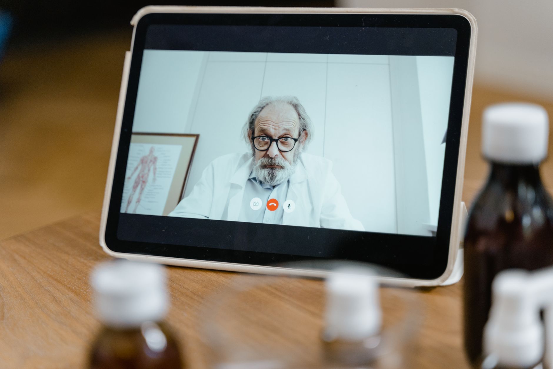 A primary care physician reviewing results with a patient at an exam visit