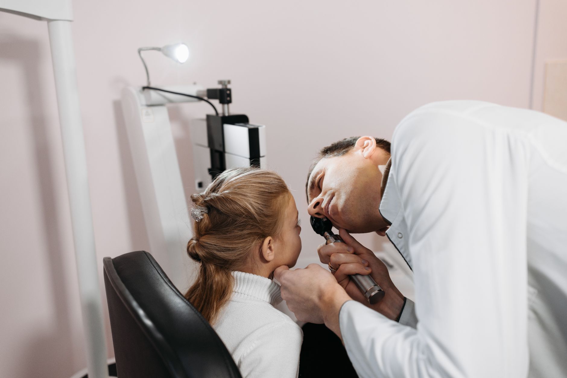 A patient receiving an eye examination in a clinic.